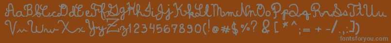 DominiqueWin-Schriftart – Graue Schriften auf braunem Hintergrund