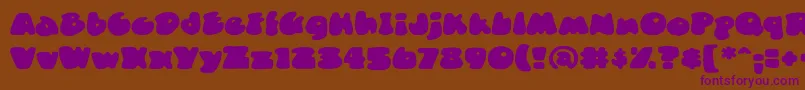 DuncecapBb Font – Purple Fonts on Brown Background