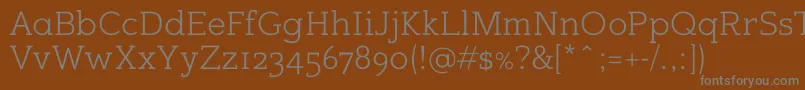 Fonte Sugarcubesregular – fontes cinzas em um fundo marrom