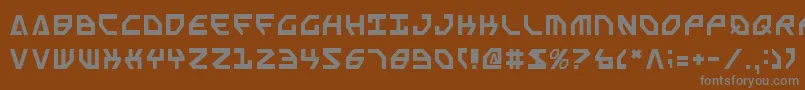 フォントScarabScript – 茶色の背景に灰色の文字