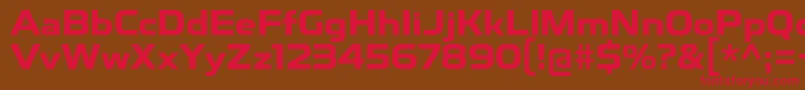 フォントToxigenesisBd – 赤い文字が茶色の背景にあります。