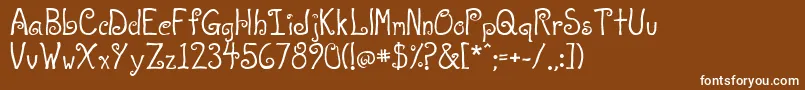 A T Love-fontti – valkoiset fontit ruskealla taustalla