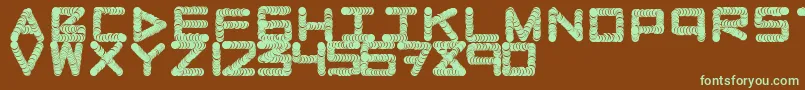 Naughtypipe-fontti – vihreät fontit ruskealla taustalla