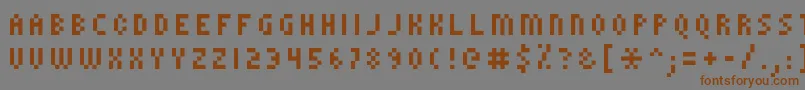 フォントKroeger0858 – 茶色の文字が灰色の背景にあります。