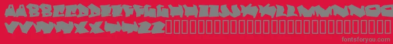 フォントDortmund – 赤い背景に灰色の文字