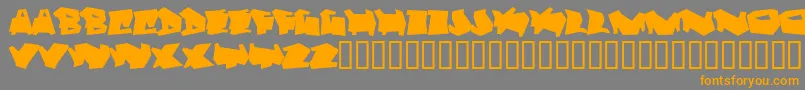 フォントDortmund – オレンジの文字は灰色の背景にあります。