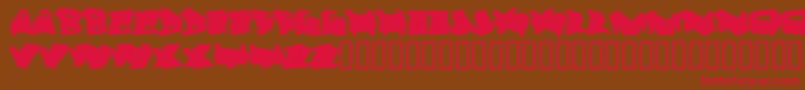 フォントDortmund – 赤い文字が茶色の背景にあります。