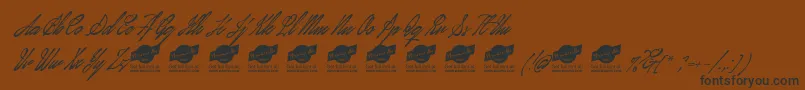 JanuaryscriptPersonalUseOnly Font – Black Fonts on Brown Background
