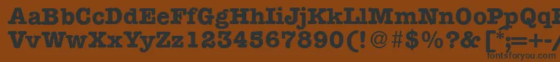 フォントModerntypewriterBold – 黒い文字が茶色の背景にあります