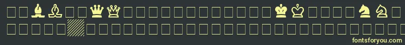 フォントChessSsi – 黒い背景に黄色の文字