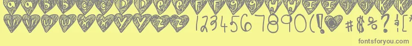 Overhearts-fontti – harmaat kirjasimet keltaisella taustalla