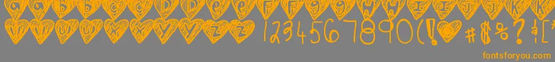 フォントOverhearts – オレンジの文字は灰色の背景にあります。