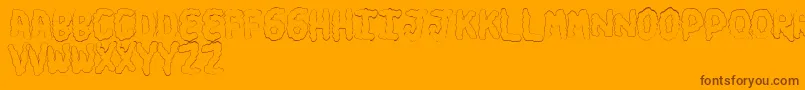 TurdsSoft-Schriftart – Braune Schriften auf orangefarbenem Hintergrund