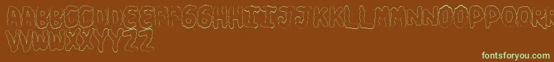 フォントTurdsSoft – 緑色の文字が茶色の背景にあります。
