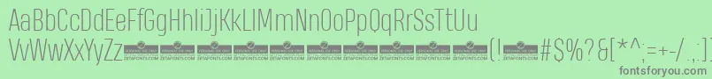 HeadingProExtralightTrial-fontti – harmaat kirjasimet vihreällä taustalla