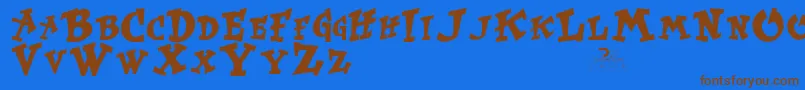 フォントKurtruss – 茶色の文字が青い背景にあります。