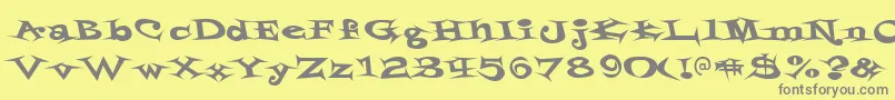 Styrofoa-fontti – harmaat kirjasimet keltaisella taustalla