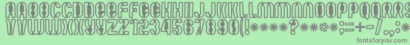 Mutefruitblackcrash-fontti – harmaat kirjasimet vihreällä taustalla
