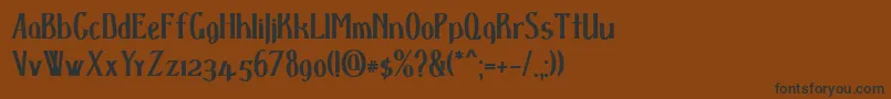 Czcionka D spenserbold – czarne czcionki na brązowym tle