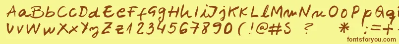 フォントBelenpison – 茶色の文字が黄色の背景にあります。