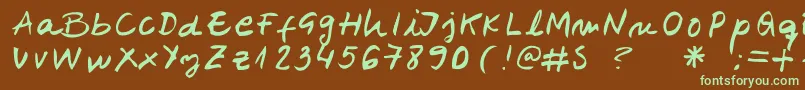 フォントBelenpison – 緑色の文字が茶色の背景にあります。