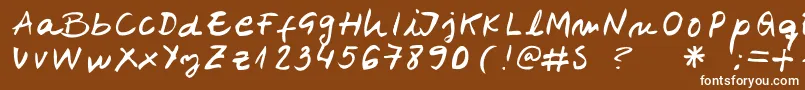 Belenpison-Schriftart – Weiße Schriften auf braunem Hintergrund