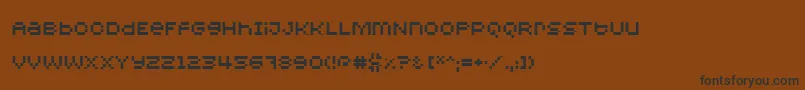 フォントRedensek – 黒い文字が茶色の背景にあります