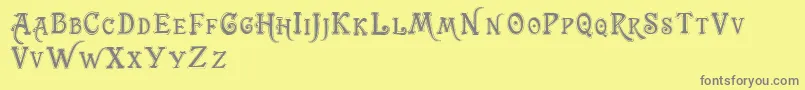 Trashbarusa-fontti – harmaat kirjasimet keltaisella taustalla