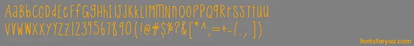 フォントHelloqueenie – オレンジの文字は灰色の背景にあります。