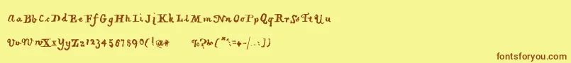 フォントPiratiquavertical – 茶色の文字が黄色の背景にあります。