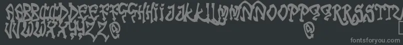 フォントTribf – 黒い背景に灰色の文字