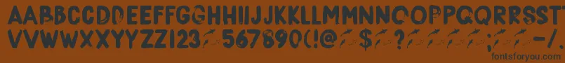 Fonte DkBorisBrush – fontes pretas em um fundo marrom