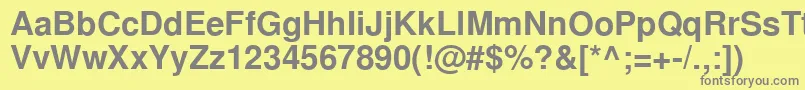 NimbussanlcyBold-fontti – harmaat kirjasimet keltaisella taustalla