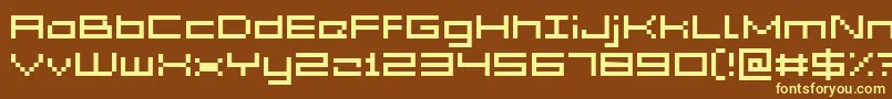 Czcionka GrixelAcme5Wide – żółte czcionki na brązowym tle