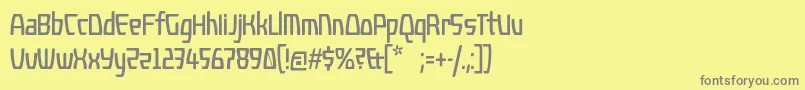 フォントKompressor – 黄色の背景に灰色の文字