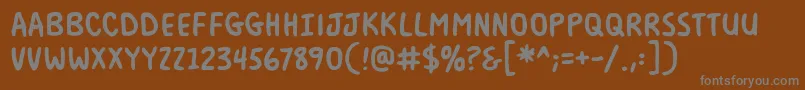 フォントMilkmustachebbBold – 茶色の背景に灰色の文字