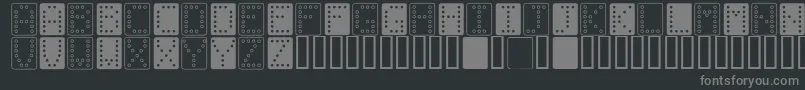 フォントDominoBred – 黒い背景に灰色の文字