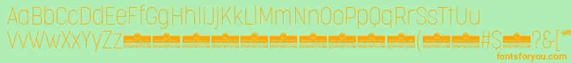 CocogooseCondensedThinTrial Font – Orange Fonts on Green Background