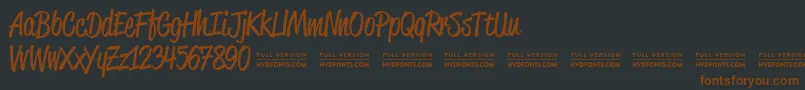 Saiba mais sobre a fonte ReklamescriptRegularDemo Fonte ReklamescriptRegularDemo – fontes marrons em um fundo preto