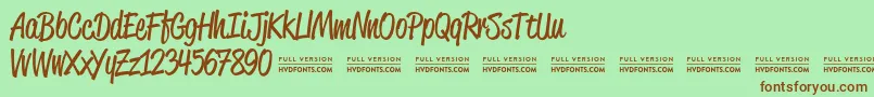 ReklamescriptRegularDemo Font – Brown Fonts on Green Background