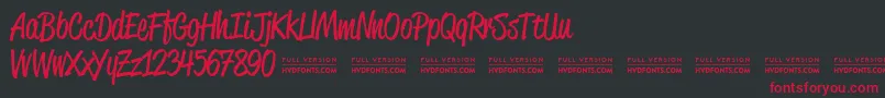 ReklamescriptRegularDemo Font – Red Fonts on Black Background