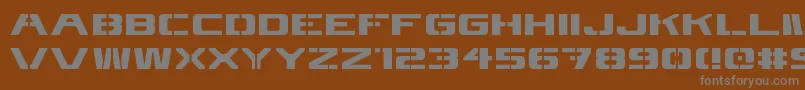 4kstncl-Schriftart – Graue Schriften auf braunem Hintergrund