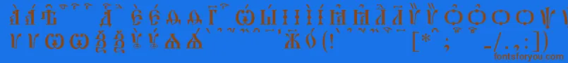 フォントPochaevskCapsKucsSpacedout – 茶色の文字が青い背景にあります。