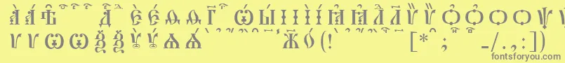 フォントPochaevskCapsKucsSpacedout – 黄色の背景に灰色の文字