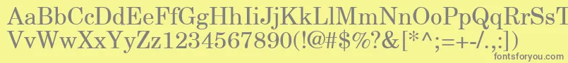 NewCenturySchlbkGreekUpright-fontti – harmaat kirjasimet keltaisella taustalla
