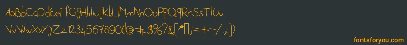 フォントJenetoublieraijamais – 黒い背景にオレンジの文字