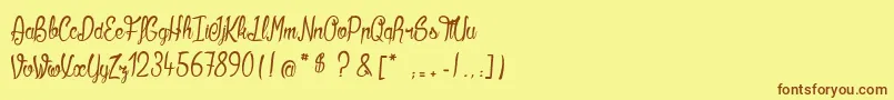 フォントKilowatts – 茶色の文字が黄色の背景にあります。