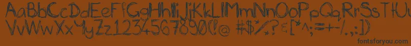 Miasscribblings-fontti – mustat fontit ruskealla taustalla