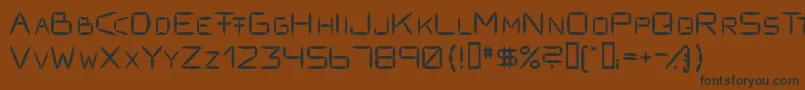Fracksausen1-fontti – mustat fontit ruskealla taustalla