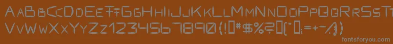 Fracksausen1-Schriftart – Graue Schriften auf braunem Hintergrund